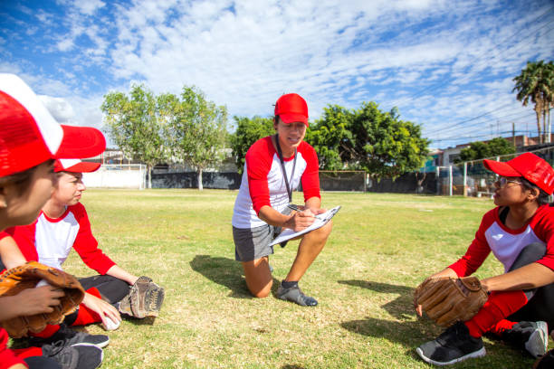 istock Teenage women on bench with coach 1297347629