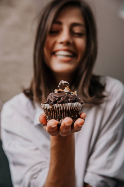 istock Cheerful female celebrating alone at home 1297351582
