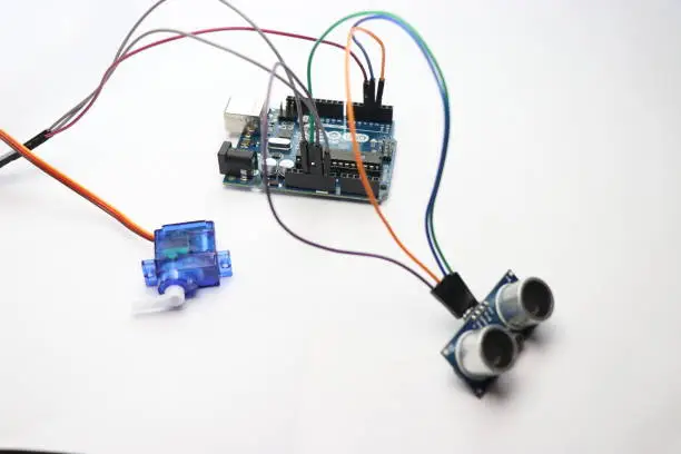 science project made using open-source hardware and software uno. open-source hardware and software uno development board projects made using micro servo and ultrasonic sensor