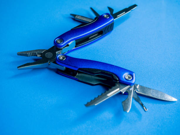 istock a Closeup shot of a blue utility pocket plier on a blue surface 1297355046