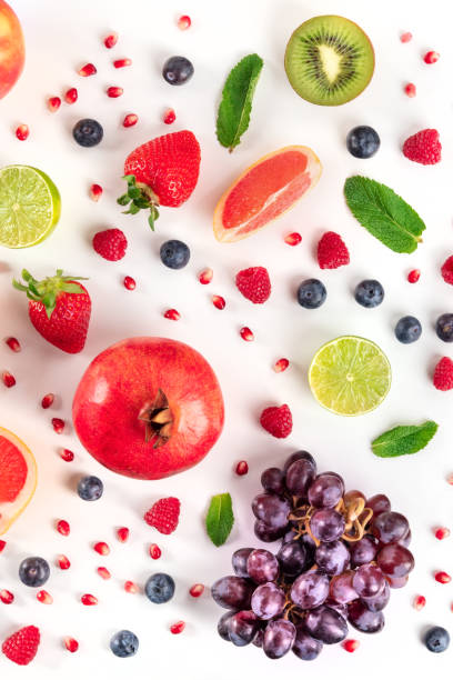 istock Fresh fruit variety. Pomegranate, grapes, blueberries etc, forming a pattern 1297356166