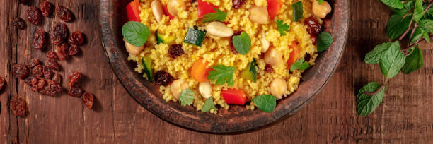 istock Moroccan couscous panorama with ingredients, top shot 1297356689