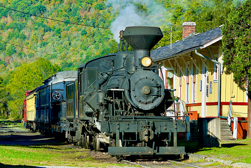 Durbin, West Virginia / USA - October 9, 2016: The Durbin Rocket’s Heisler No. 6 coal-fired steam locomotive sits idling at the Durbin Station.