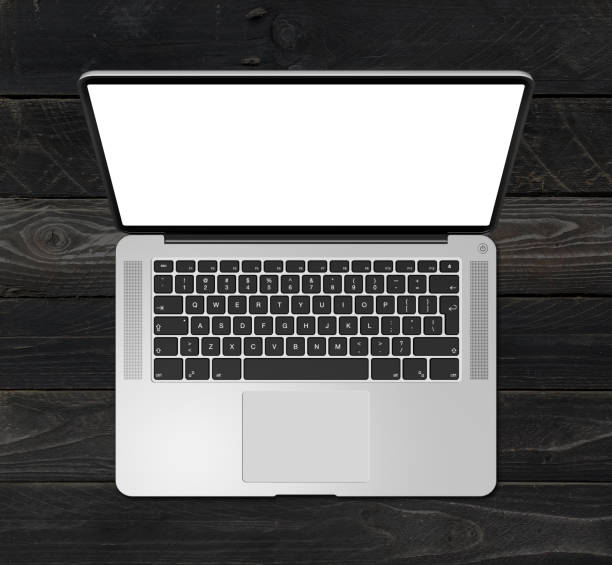 istock Open laptop top view with blank screen, isolated on black wood background. 3D render 1297359052