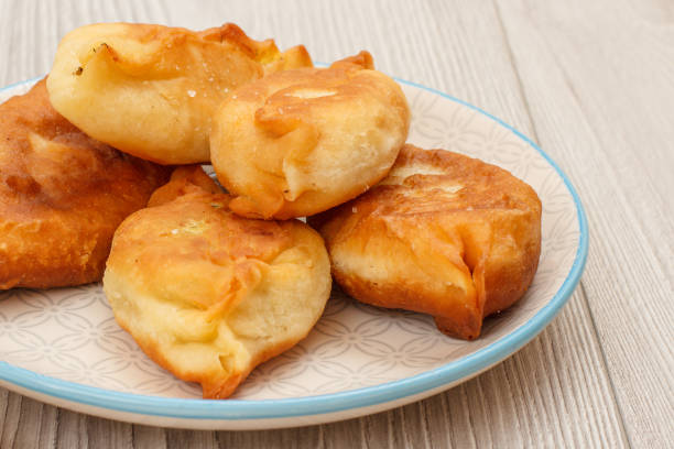 istock Plate with fried pies on wooden boards 1297359776