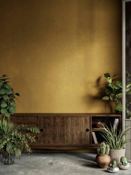 istock Yellow interior with plants, dresser, stucco wall and decor. 1297360078