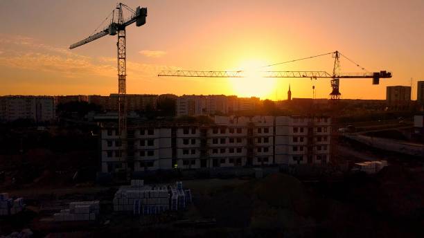 istock Aerial of Construction Site and Cranes at Sunset 1297364784