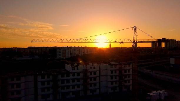 istock Aerial of Construction Site and Cranes at Sunset 1297364811