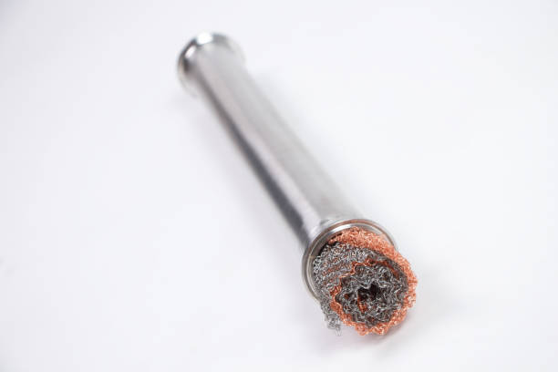 istock Isolated photo of metal rolled grid filter in iron pipe 1297364896