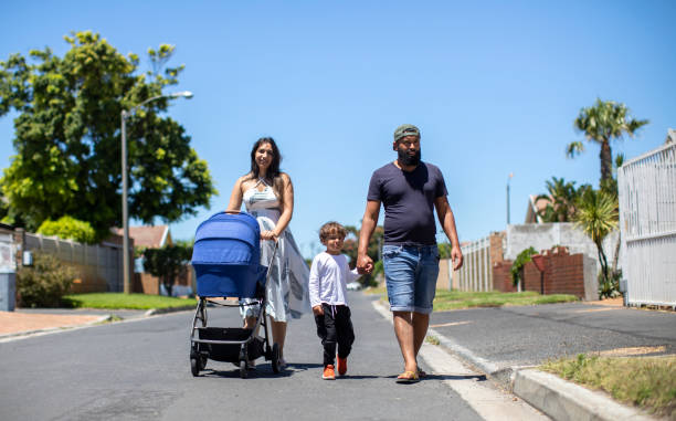 istock A young family going for a walk around the block. 1297365787