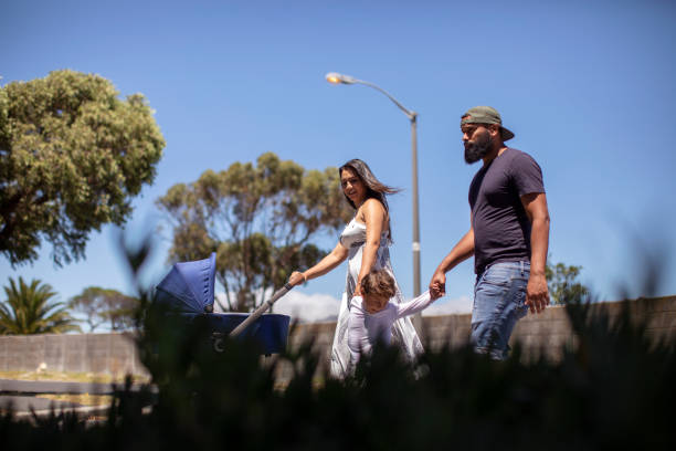 istock A young family going for a walk around the block. 1297365788