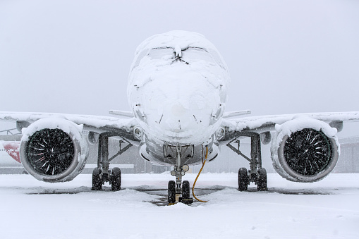 Aircraft covered with snow after a snow storm
