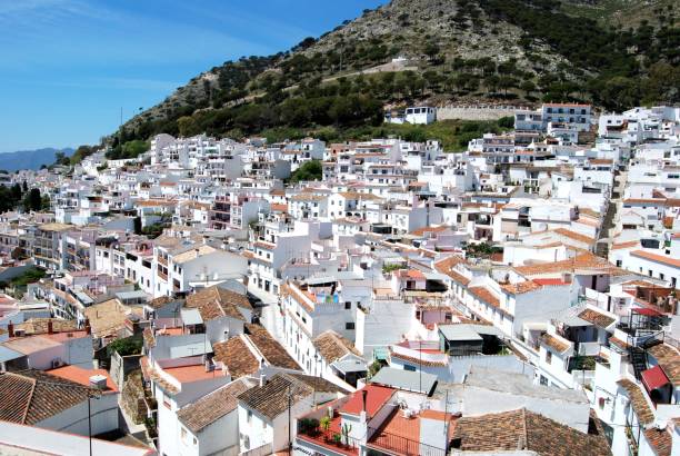 White village, Mijas, Spain. Elevated view across the town rooftops, Mijas, Spain. mijas pueblo stock pictures, royalty-free photos & images