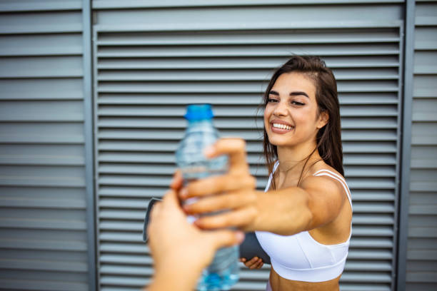 istock Group of athletes relaxing and resting after hard street workout session. 1297367859