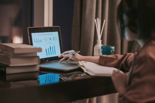 istock asian chinese beautiful woman using laptop working from home in study room writing headset 1297367987