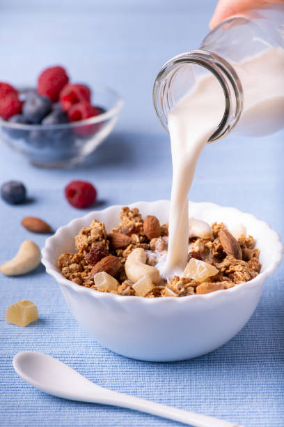 istock healthy breakfast with wholemeal muesli, fruit and fresh milk 1297368294