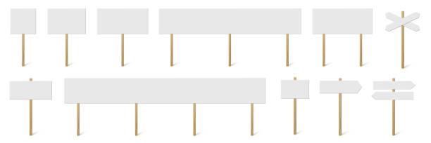 istock Signposts and banners with blank boards set. Wooden sticks with white signs vector illustration. Retro street direction posts isolated on white background. Simple empty information placards 1297370739