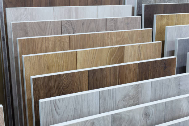 istock Laminate background. Samples of laminate or parquet with a pattern and wood texture for flooring and interior design. Production of wooden floors 1297370886