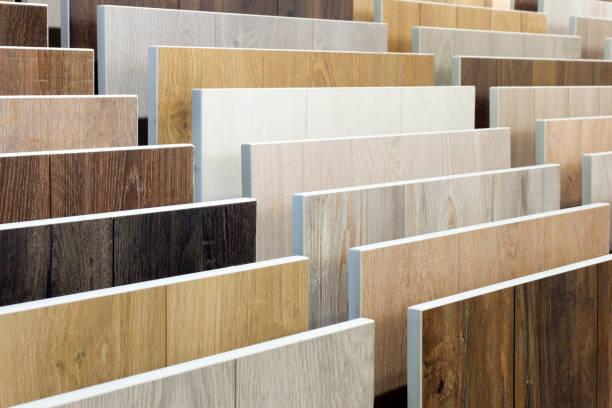 istock Laminate background. Samples of laminate or parquet with a pattern and wood texture for flooring and interior design. Production of wooden floors 1297370900
