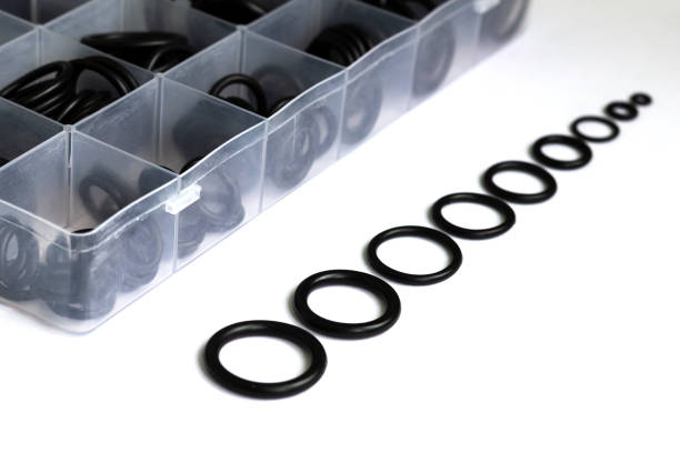 Rubber rings for creating tight connections in the automotive, marine and aviation industries. A set of rubber sealing gaskets. Rubber rings for creating tight connections in the automotive, marine and aviation industries. gasket stock pictures, royalty-free photos & images