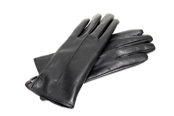 istock Black leather gloves isolated on white background 1297374878