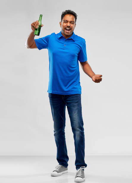 istock male fan with beer bottle celebrating victory 1297375809