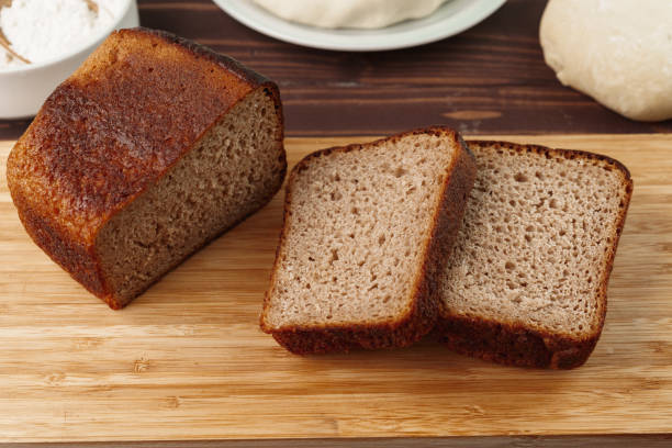 istock Sliced rye bread on brown wooden background 1297376337