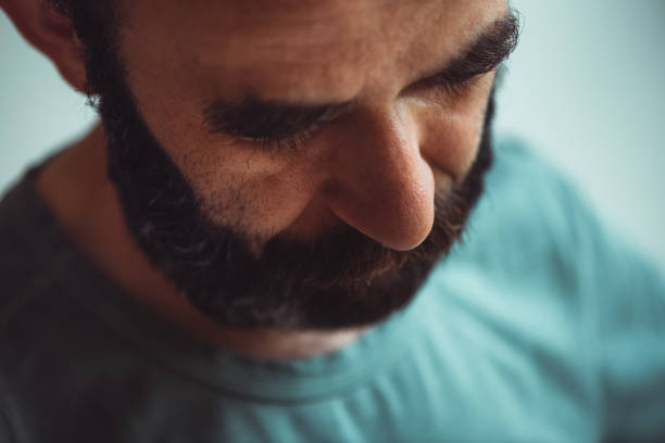 Portrait: Extreme close-up of a man concentrating while he is working