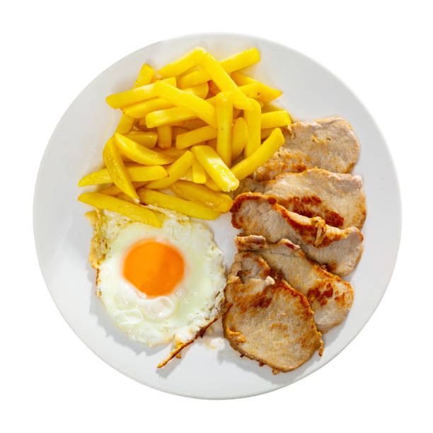 istock close up of grilled pork with fried potato and egg served 1297378920