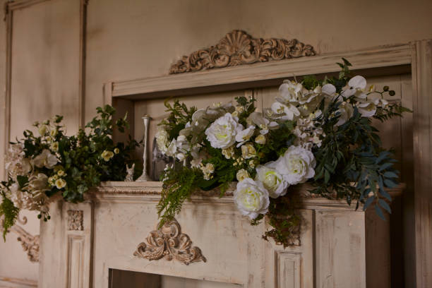 istock Fireplace with candles decorated with flowers 1297381975