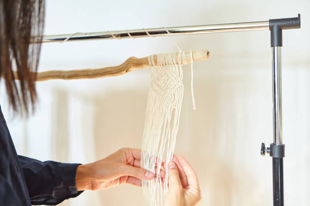 istock The Girl Prepared To Make A Macrame. Hand made macrame. 1297381986
