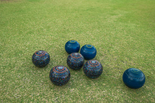 istock Lawn bowls balls scattered in a field after the game 1297382087