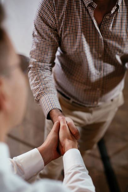 istock Close up of men handshake in office. 1297382751