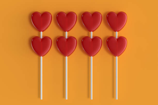 istock Happy Valentine's day heart shaped candy with orange color background 1297383489
