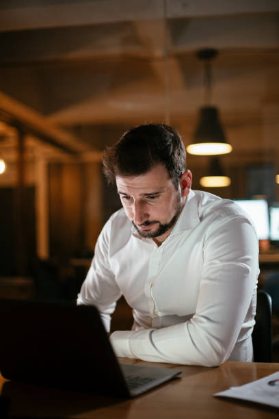 istock Young businessman working with laptop at office. 1297384137