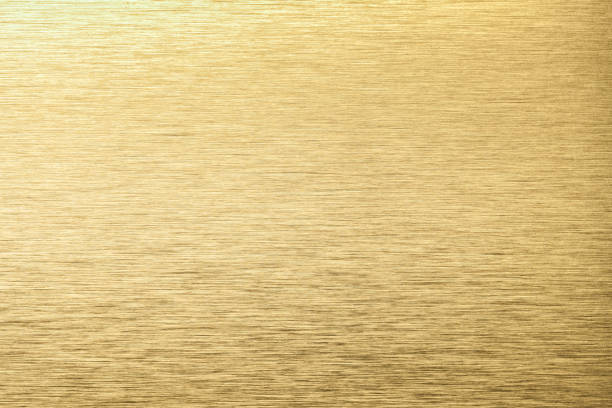 istock Golden aluminum texture background. Yellow stainless texture metal backdrop. 1297391116