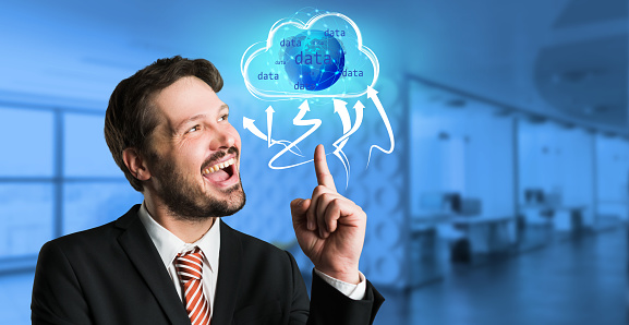 businessman interacting with a virtual cloud in front of an office background