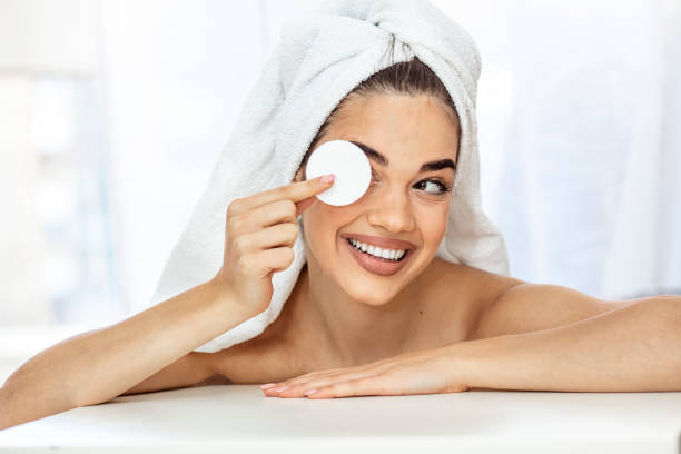 istock Woman Cleaning Face With White Pad. 1297392899