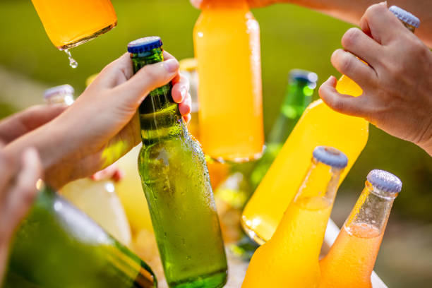 istock Grabbing ice cold beer bottles from a cooler 1297392978