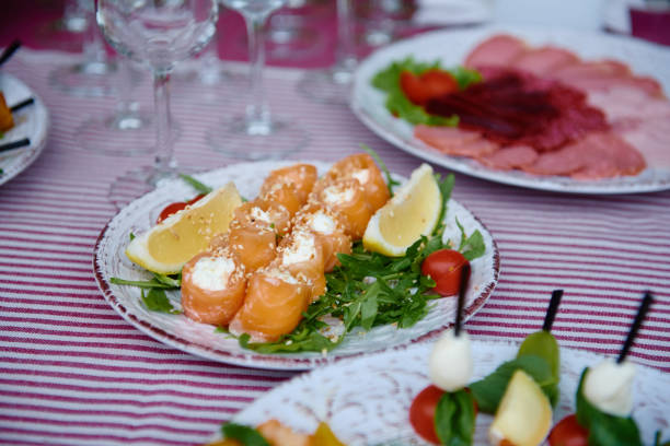 istock Buffet table with snacks, canape and appetizers at luxury wedding reception outdoors, copy space. Serving food at event. Catering banquet table 1297393071