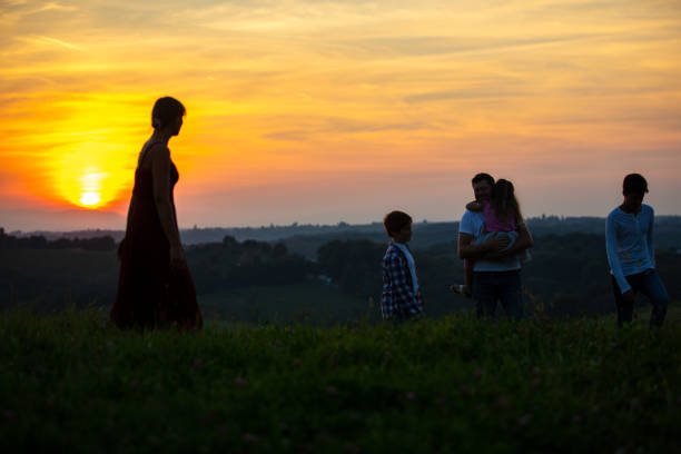 istock Family walking together on meadow 1297396836