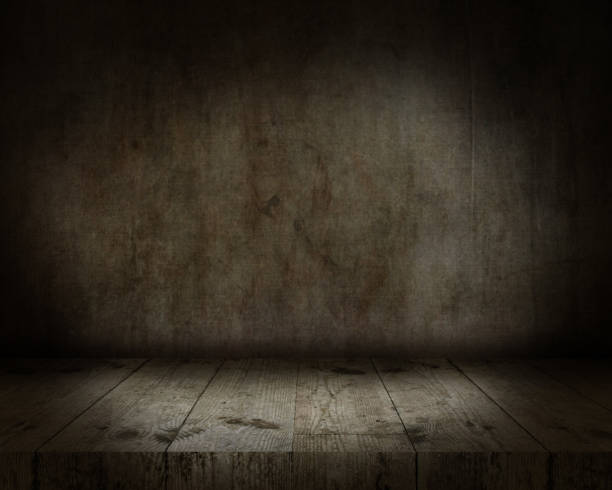 istock 3D wooden table looking out to a grunge interior 1297397928