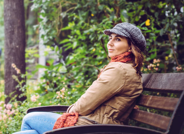 istock Woman relaxing on the bench after work 1297399165