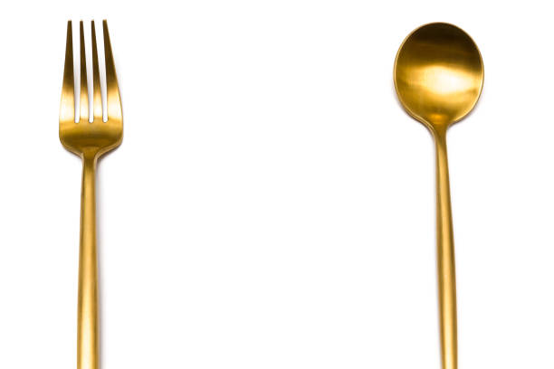 istock Cutlery, spoon and fork in gold 1297400992