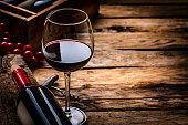 Red wineglass and bottle. Copy space