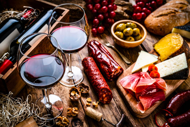 istock Spanish food: red wine, cheeses, sausages and Serrano ham. 1297401634