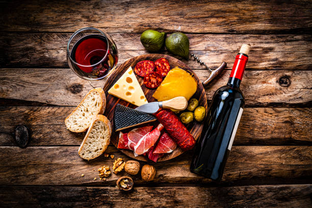istock Spanish food: red wine, cheeses, sausages and Serrano ham. 1297401640