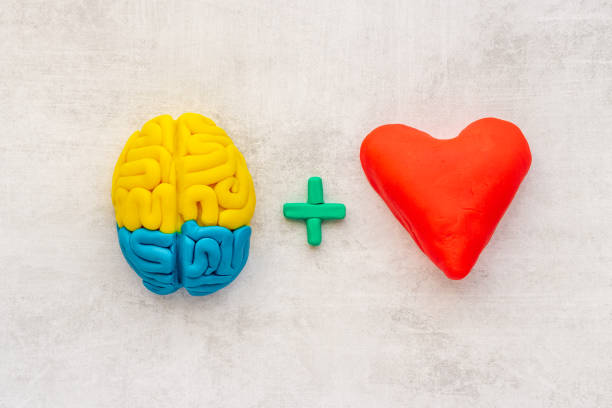 istock Think with love - heart and brain concept, top view 1297402782
