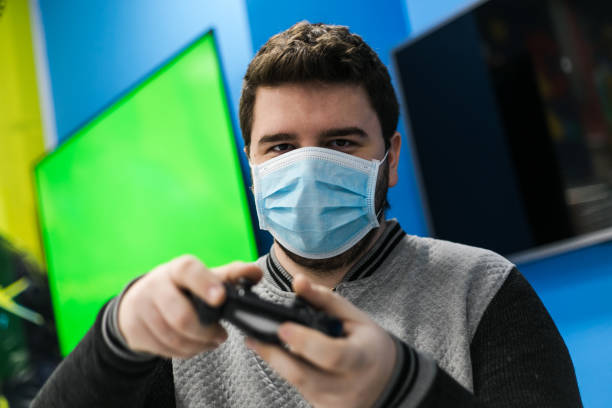 istock One guy playing video games on green screen 1297403758