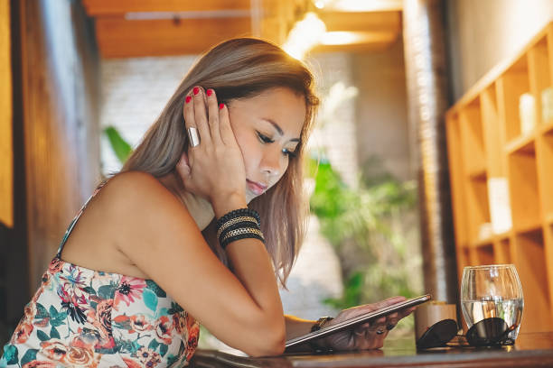 istock Freelancer working late at coffee shop 1297403950